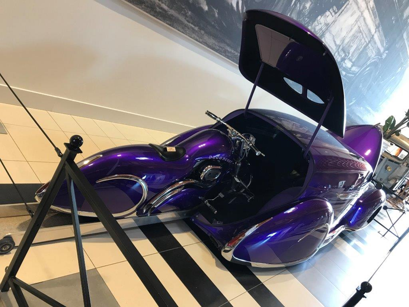 The bike and ramp withdraw into the car electrically.